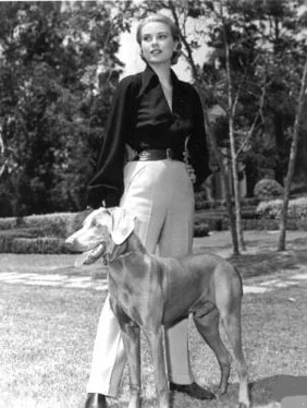 Grace Kelly (1956) and her Weimaraner, a wedding present from her brother jack, and given to her before she left America to marry Prince Rainier of Monaco in 1956.
