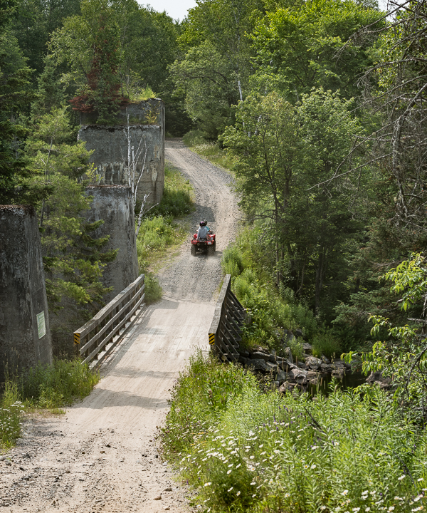 The old trestle structure alongside the bridge at Seguin Falls.