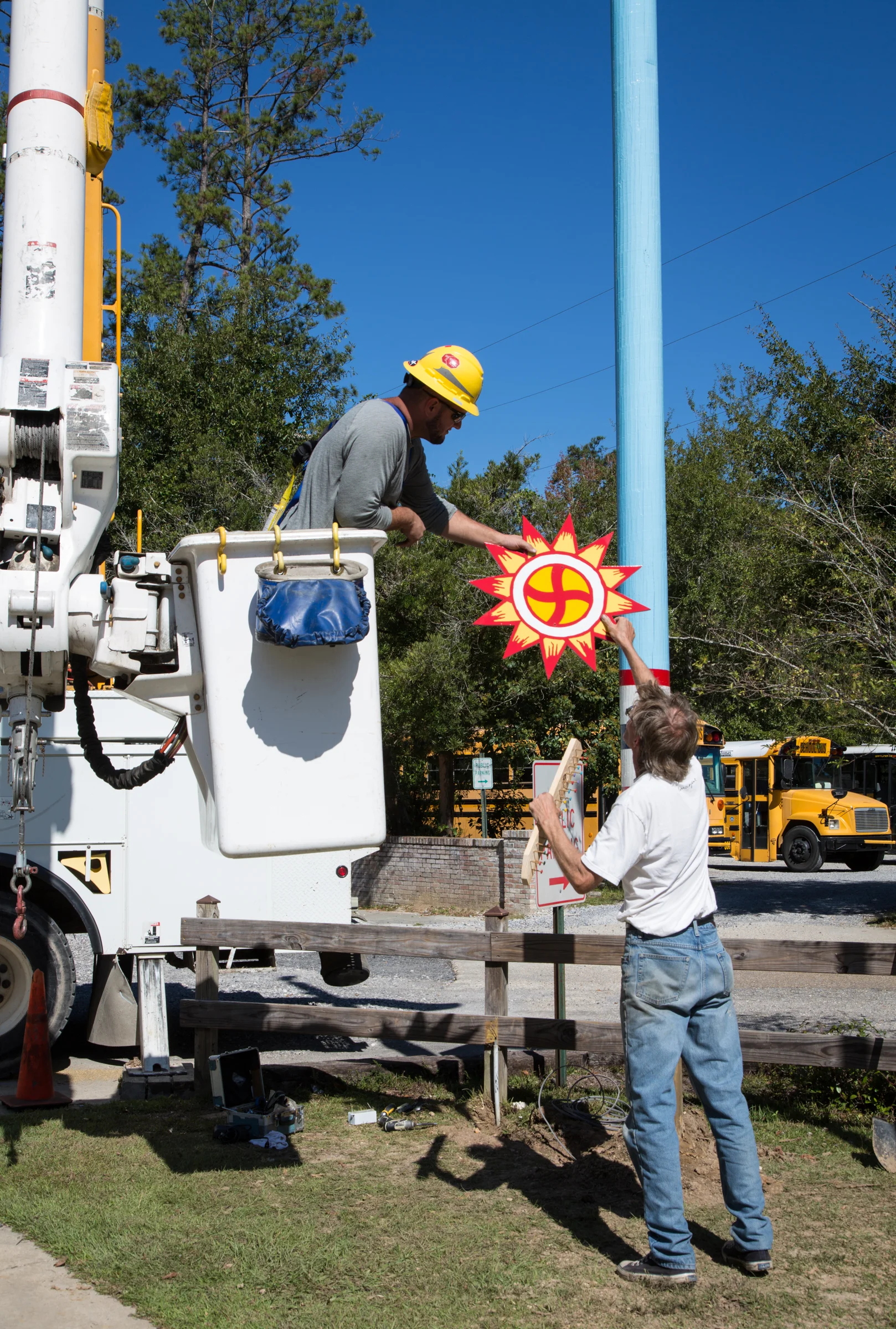 Dave Kelsey hands off his sun sign to Cleco