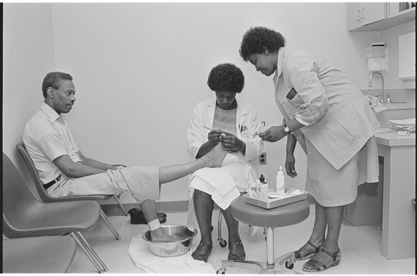 Joyce_nichols_and_Shirley_Thompson_treat_a_patient.jpg