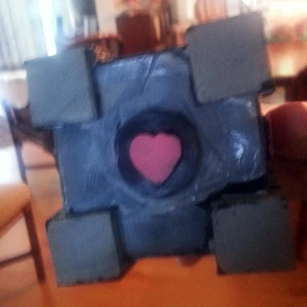 Q's very own, hand-made, artisinal Companion Cube. Like a good artist he is not quite satisfied and wants to make some alterations.