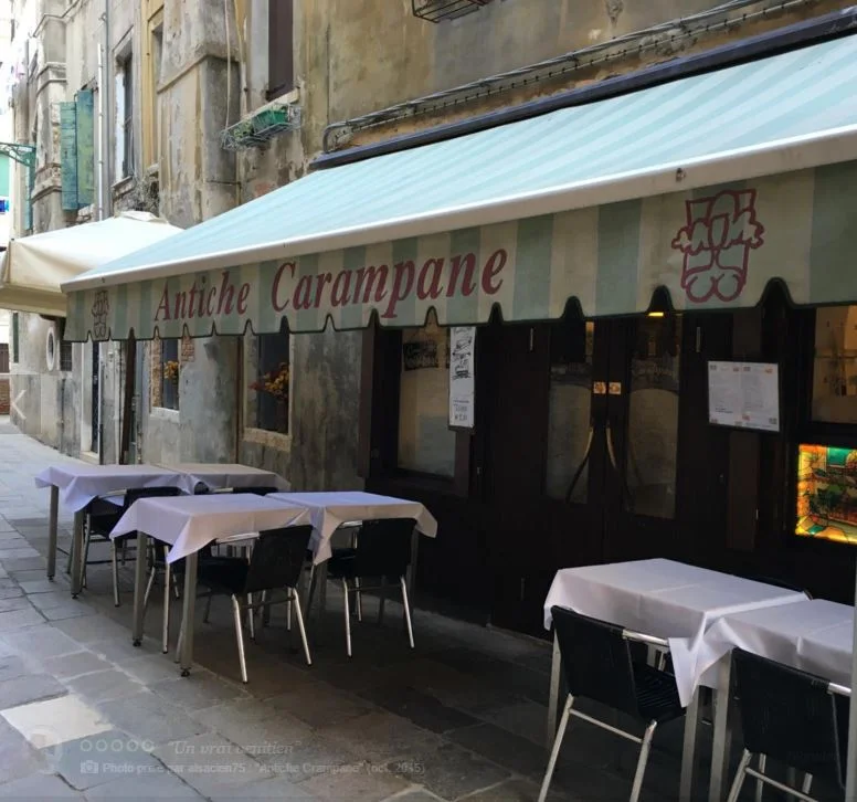 TRATTORIA ANTICHE CARAMPANE This trattoria hidden between the Campo San Polo and the market of fishes of Rialto is the busy place of Venetian and tourists who don't like being considered as such! The policy: "No pizza, No lasagna, No touristic menu". The menu is exclusively with fresh fishes, vegetables, and seasonal fruits coming from the laguna. 