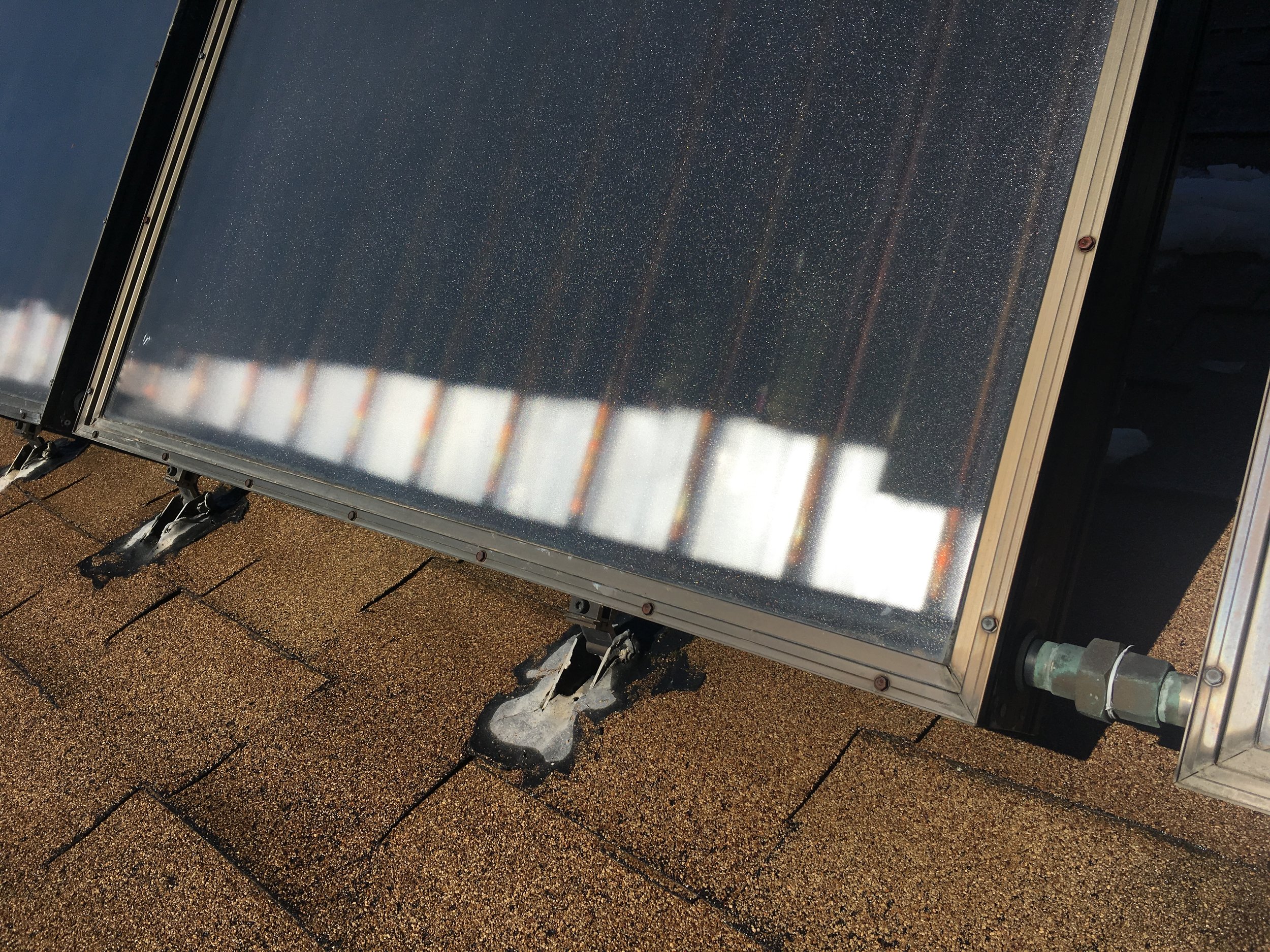 Damaged solar thermal panels and mounting feet