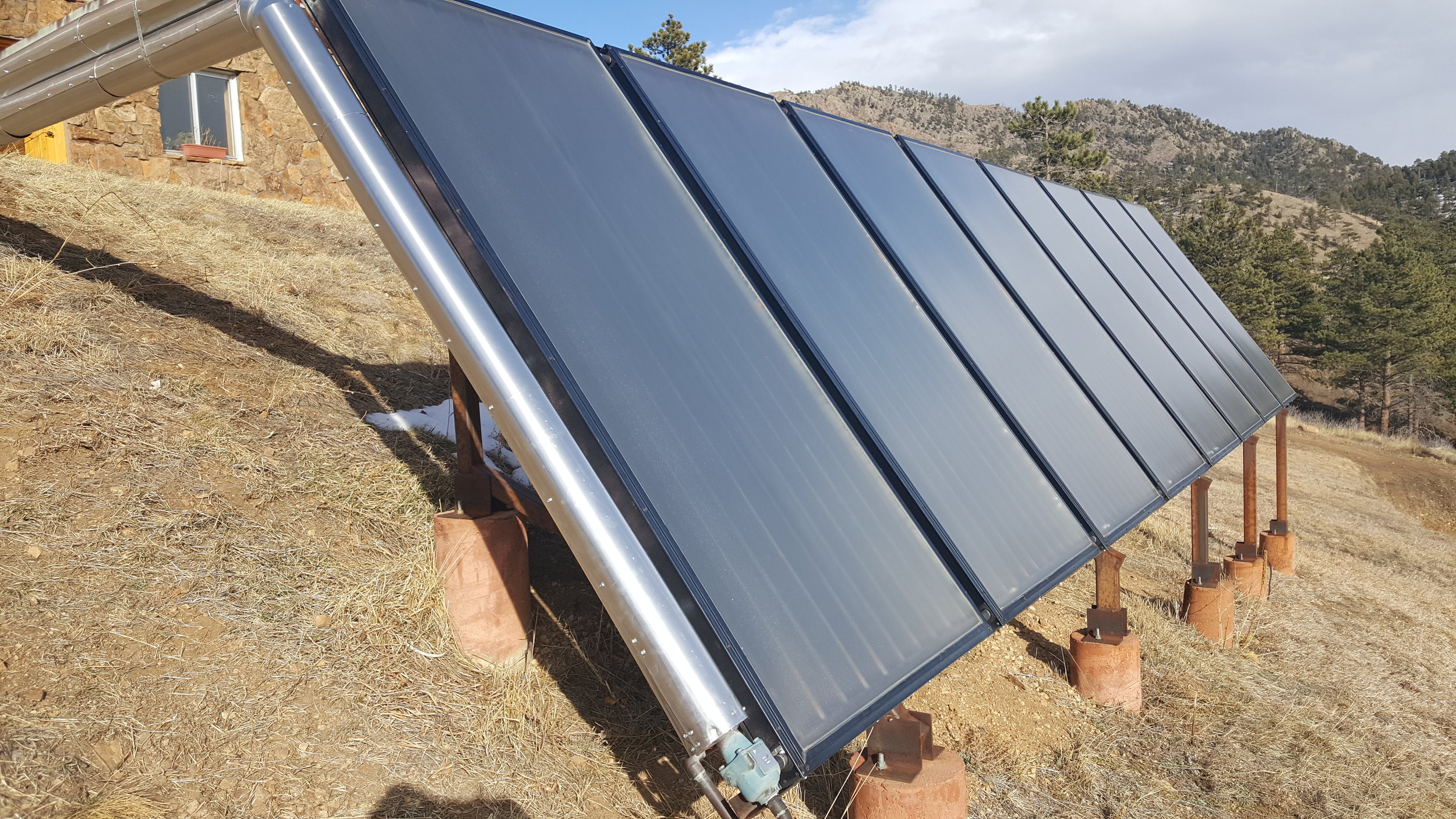 Eight ground mounted solar thermal panels in Jamestown, Colorado