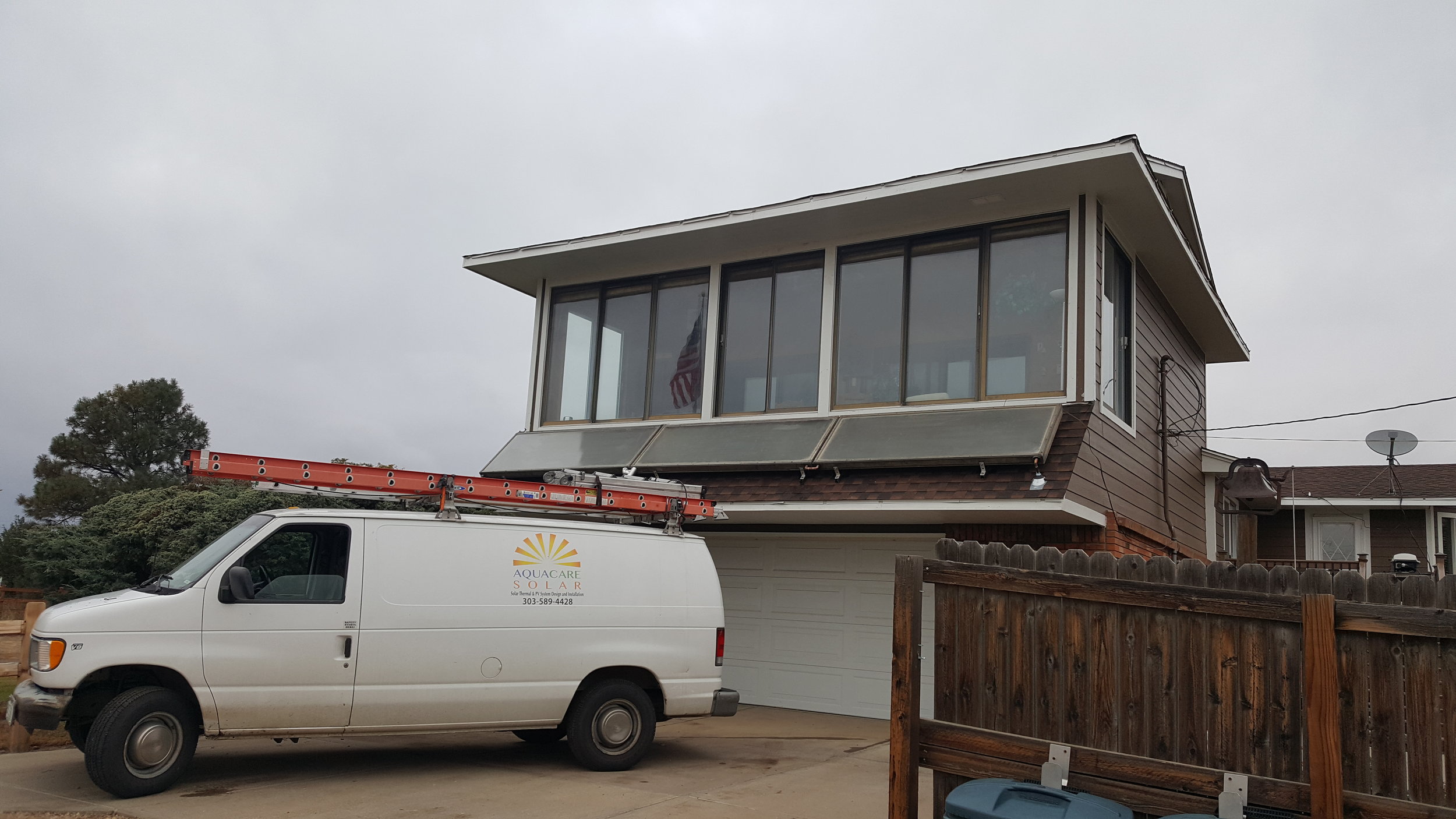 Three horizontal solar thermal panels in Brighton, Colorado