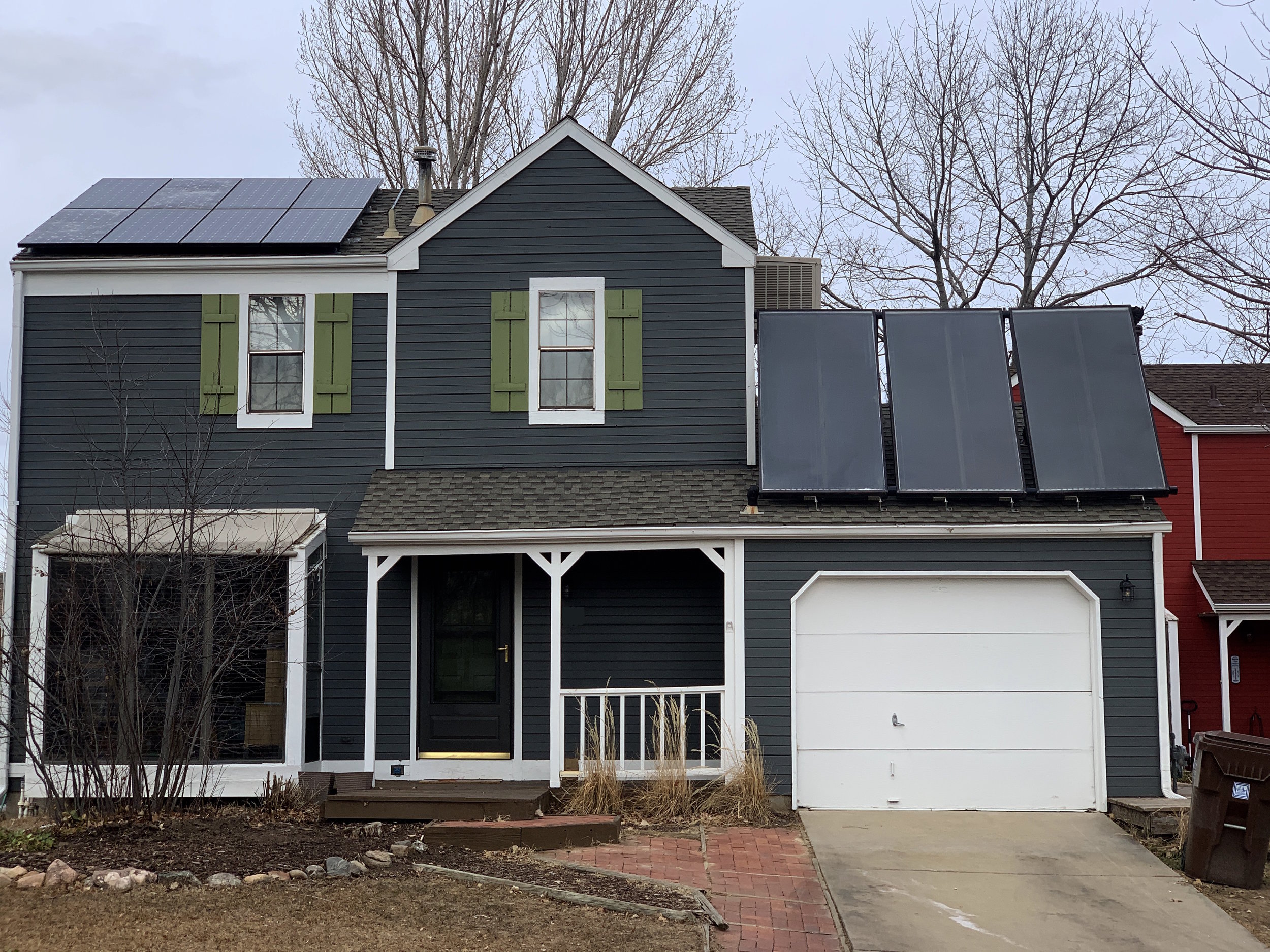 Three tilt up solar hot water panels coupled with solar PV located in Louisville, Colorado
