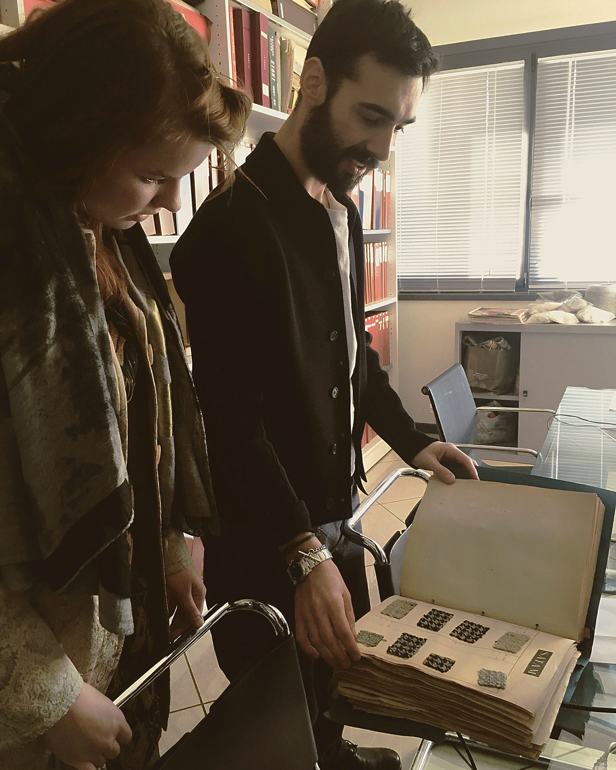 Liselore and Guido from Lanificio Bisentino looking at archive materials