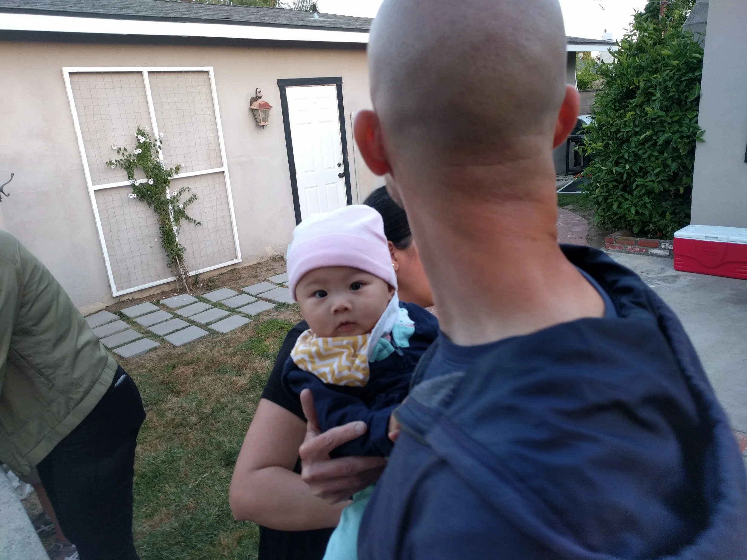 The twin catches us snapping her picture.
