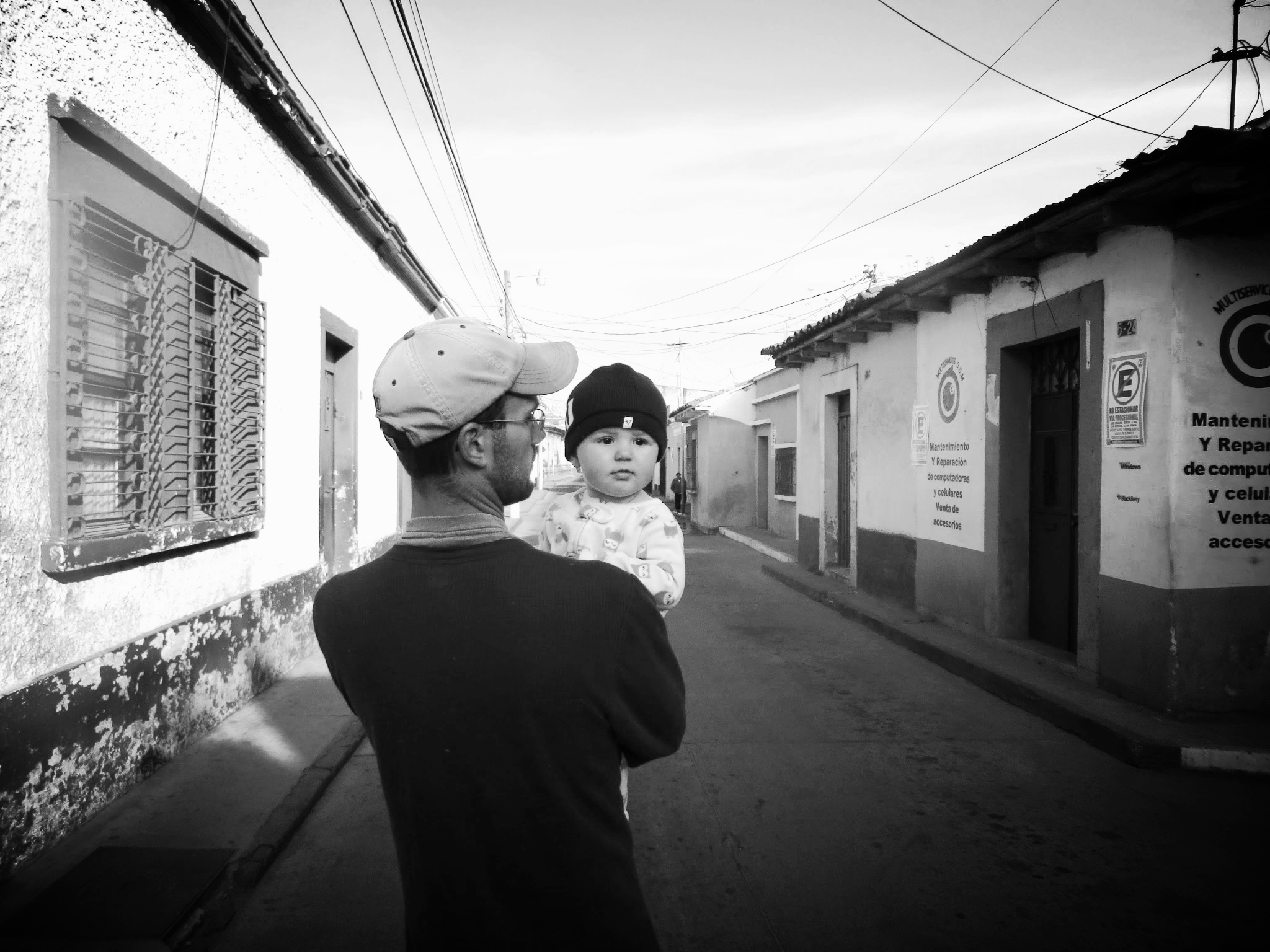 Husband and Toddler {at 9 months} walking through our neighborhood streets in Guatemala. 