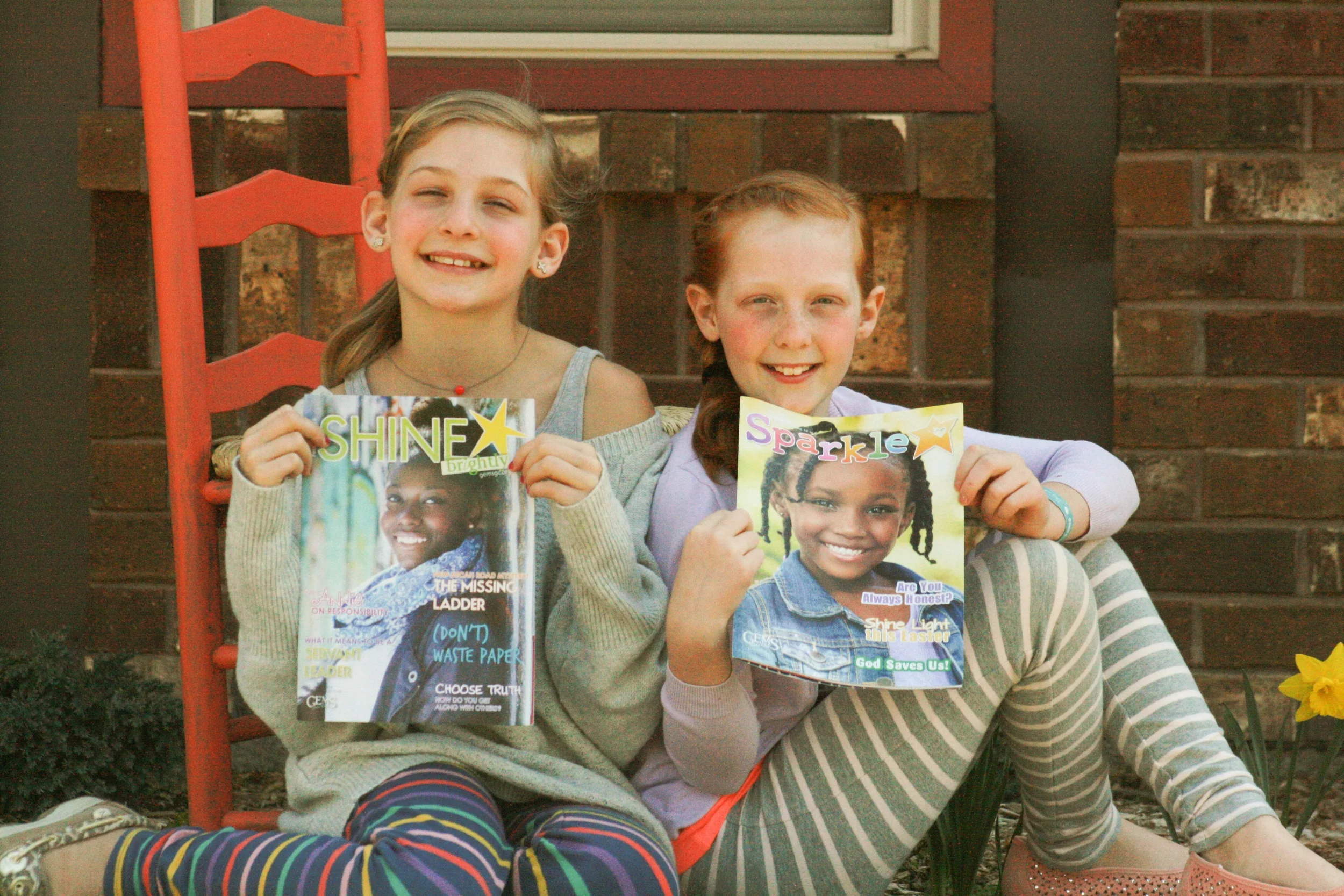 My lovely nieces Faith and Felicity, GEMS Girls Club attendees as well as Sparkle and SHINE brightly readers. Sparkle is written for girls ages 6-8, and SHINE brightly is written for girls ages 9-14. These magazines are used as curriculum for GEMS clubs, but are also available by subscription. Read to learn more and also find out how you can win a free yearlong subscription to one of these two magazines! {Photos by Amber VanderVennen.}