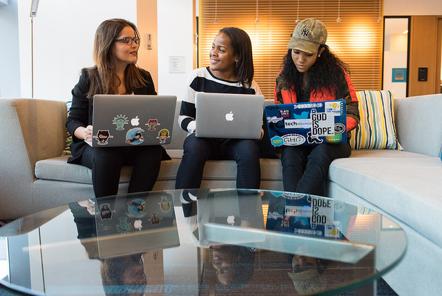 3 students with computers (photo credit WOCinTechnology)