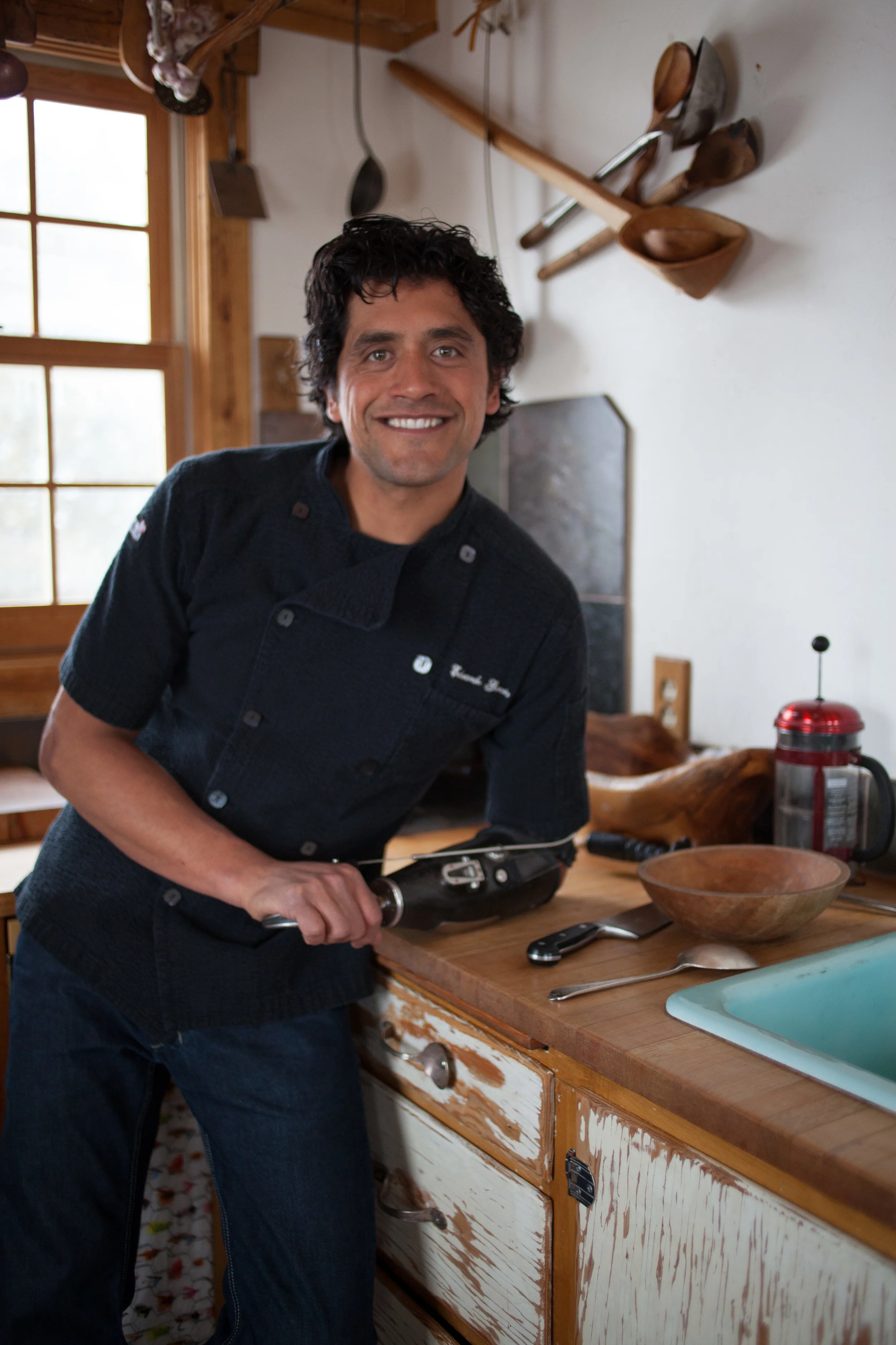 Eduardo back in his chef coat and rocking it in the kitchen once again.