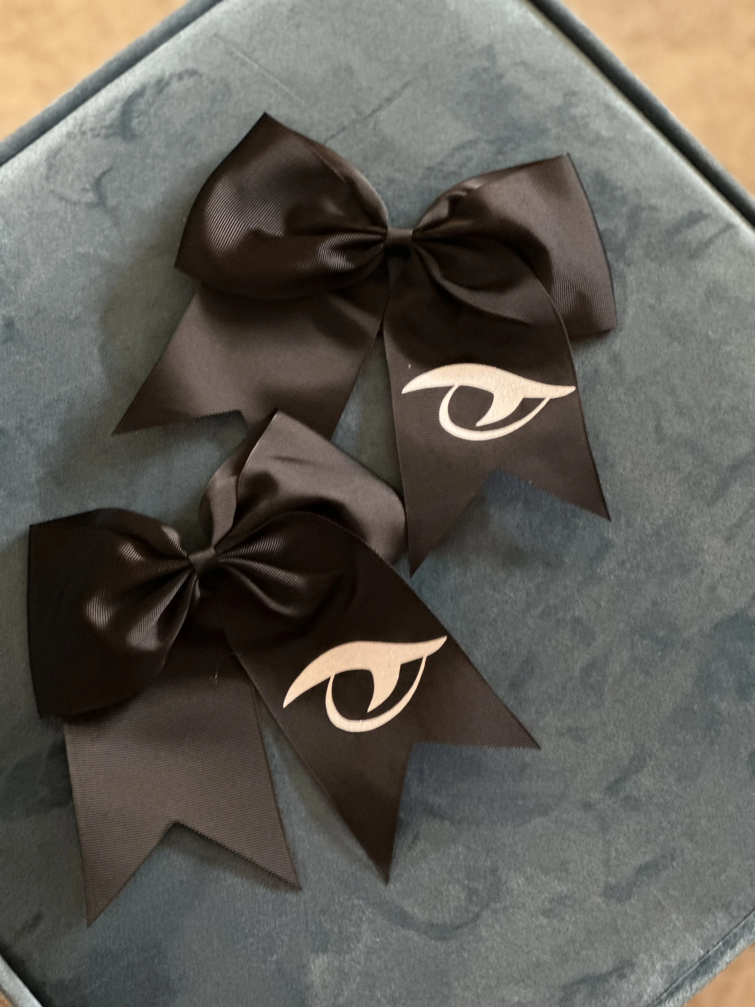 cheer bow black w white gator eye.jpeg