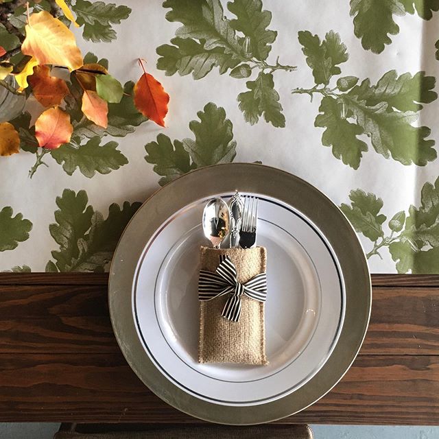 Friendsgiving starting right about now @heystudiobham 😍a simple paper runner and leaves from the neighborhood....our little burlap napkin and silverware holder were the perfect last touch for this table...