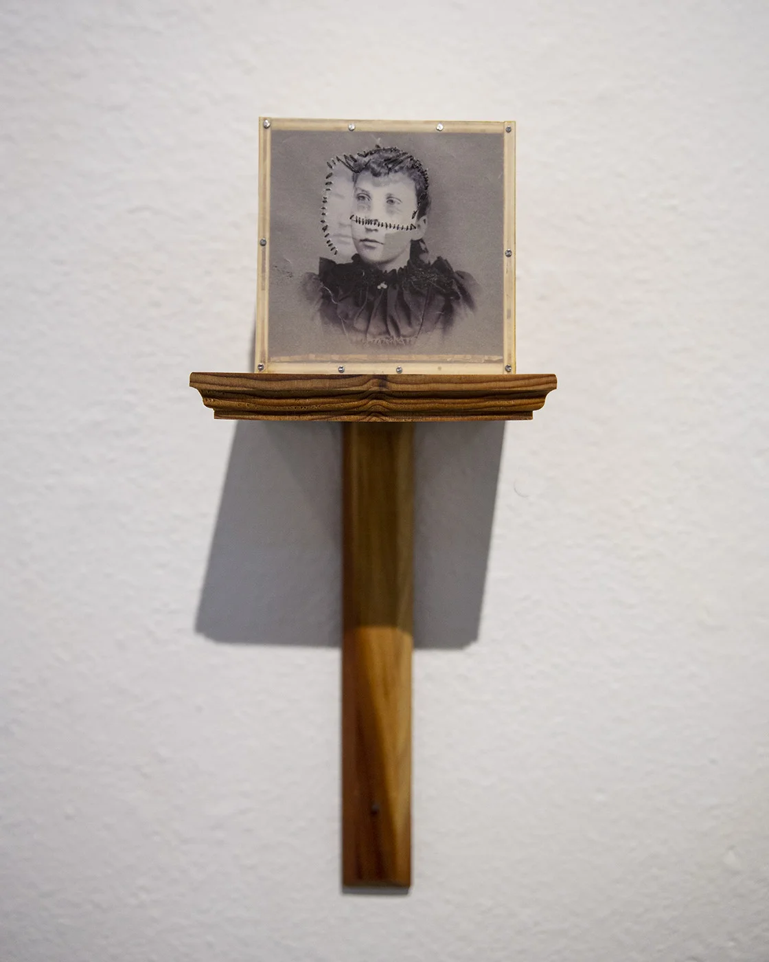 You don’t really want to know who I am, do you?, 2017. Mixed media graphoscope with redwood shelf. 5”D x 5W” x 19H”.