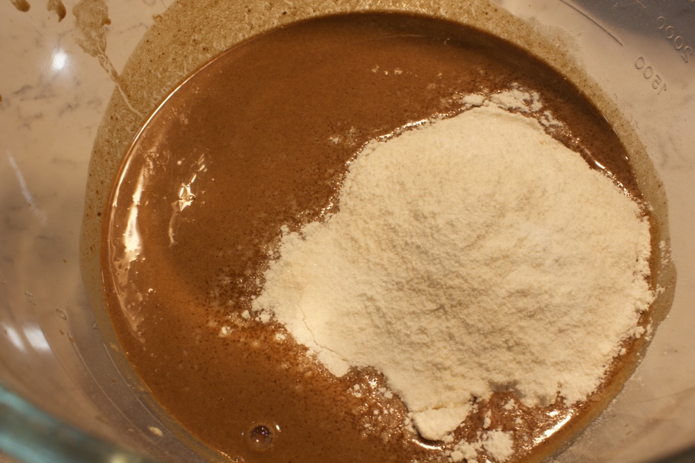  Add the flour mixture to the bowl in three batches, stirring after each addition 