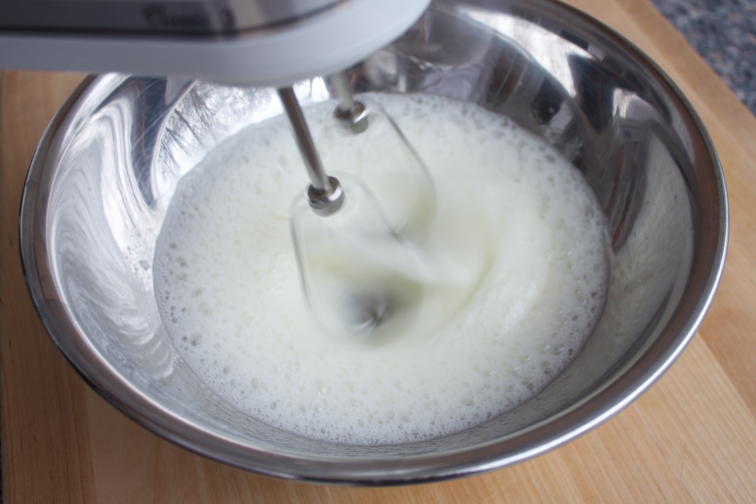 1) Using a hand mixer, whip the egg whites in a separate bowl