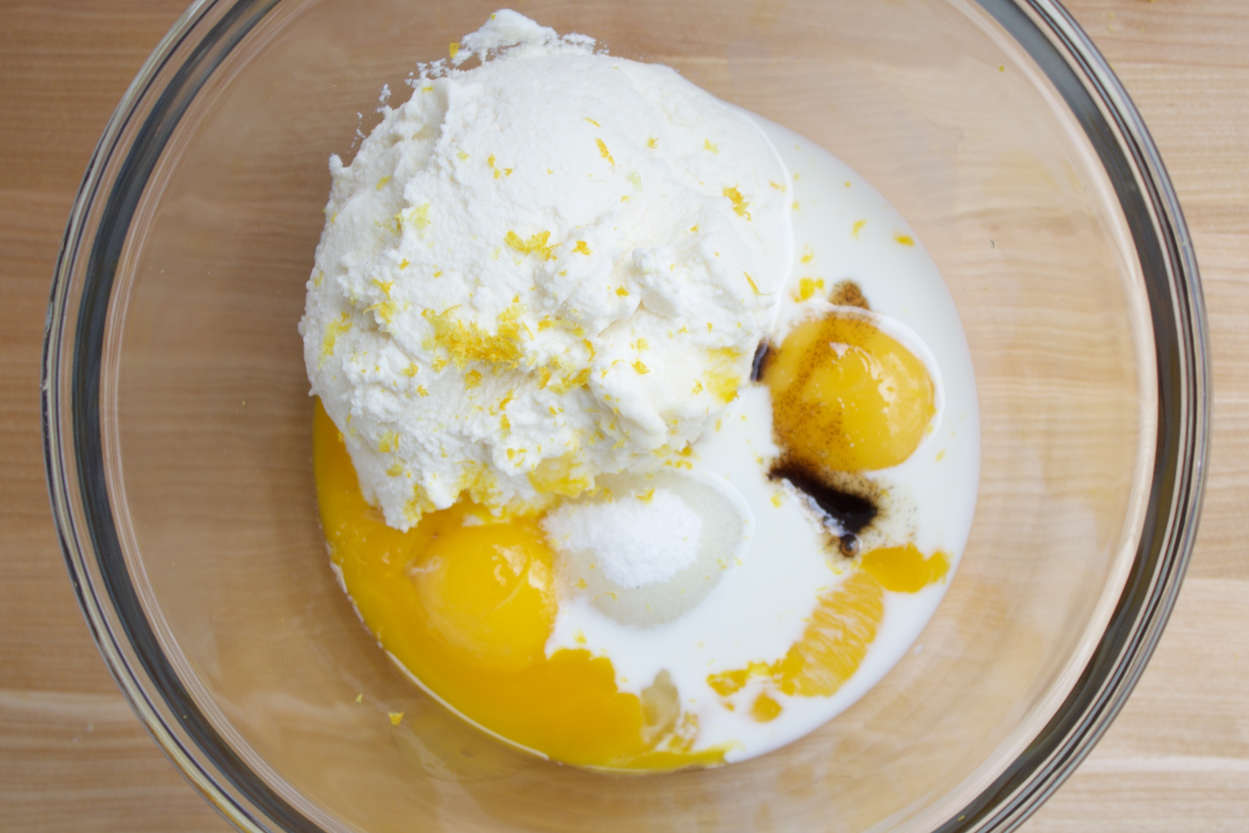 4) Combine egg yolks, sugar, vanilla, ricotta, lemon zest, and milk