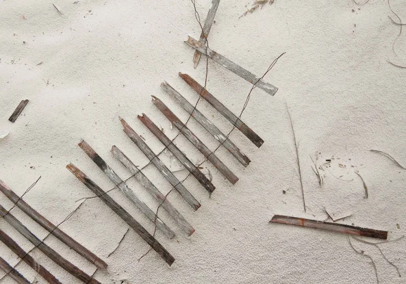 "Wood Fence and Sand Composition"