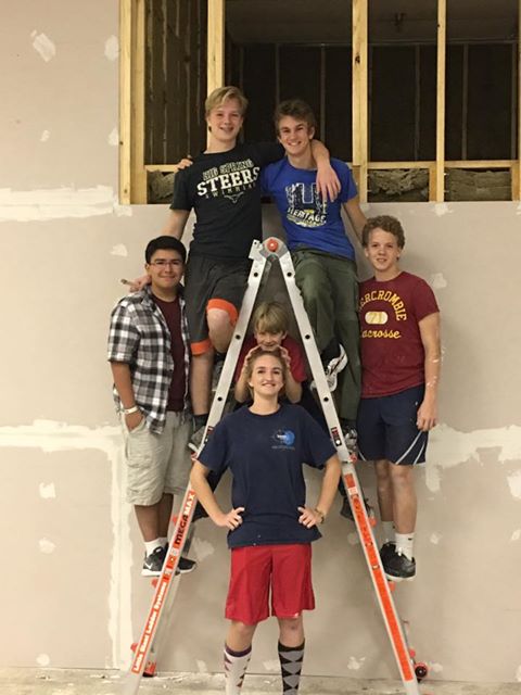 A couple of months ago, Thomas Adams, who plays Tevye in our upcoming production of Fiddler on the Roof, came to us with an idea. He expressed that he would like to take on the construction of part of our theater as his Eagle Project. After speaking with his family, we decided to set aside time during spring break to begin this project. On the morning of day four, we have a confession to make; we grossly underestimated these kids!! Their work ethic has been unmatched! They entered like a force with mentors and teen volunteers alike and have performed nothing short of a miracle! They have helped frame walls, hang sheetrock, taped and floated dry wall, sanded, painted, etc. It has been inspiring, to say the least, to witness the dedication and grit of these young teens! They have lit a fire in our team and have given us the strength and energy to trudge forward into what seemed like an impossible feat! Due to time constraints on this project, we have not been able to raise funds for its completion. We have been comparing each day to manna from heaven as we continue to be able to purchase the supplies needed for one day at a time. Key people have shown up at just the right time to step in and instruct and build just as we are ready. Each day there are more teenagers that show up and get excited to help! Their spark has truly turned into a flame and they are determined to get our theater performance ready! We love that the students in our organization are literally making the completion of our theater a reality much sooner than we had anticipated. We are asking that you donate to their efforts and please share this story with your sphere of influence. These kids deserve to be able to see this through as they are more than willing to put in the work. In a day of entitlement, it has been refreshing to see such character exemplified in these young people. We have been humbled by their service and dedication. 