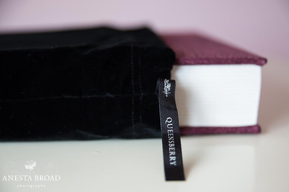 Albums are protected inside a velvet bag.