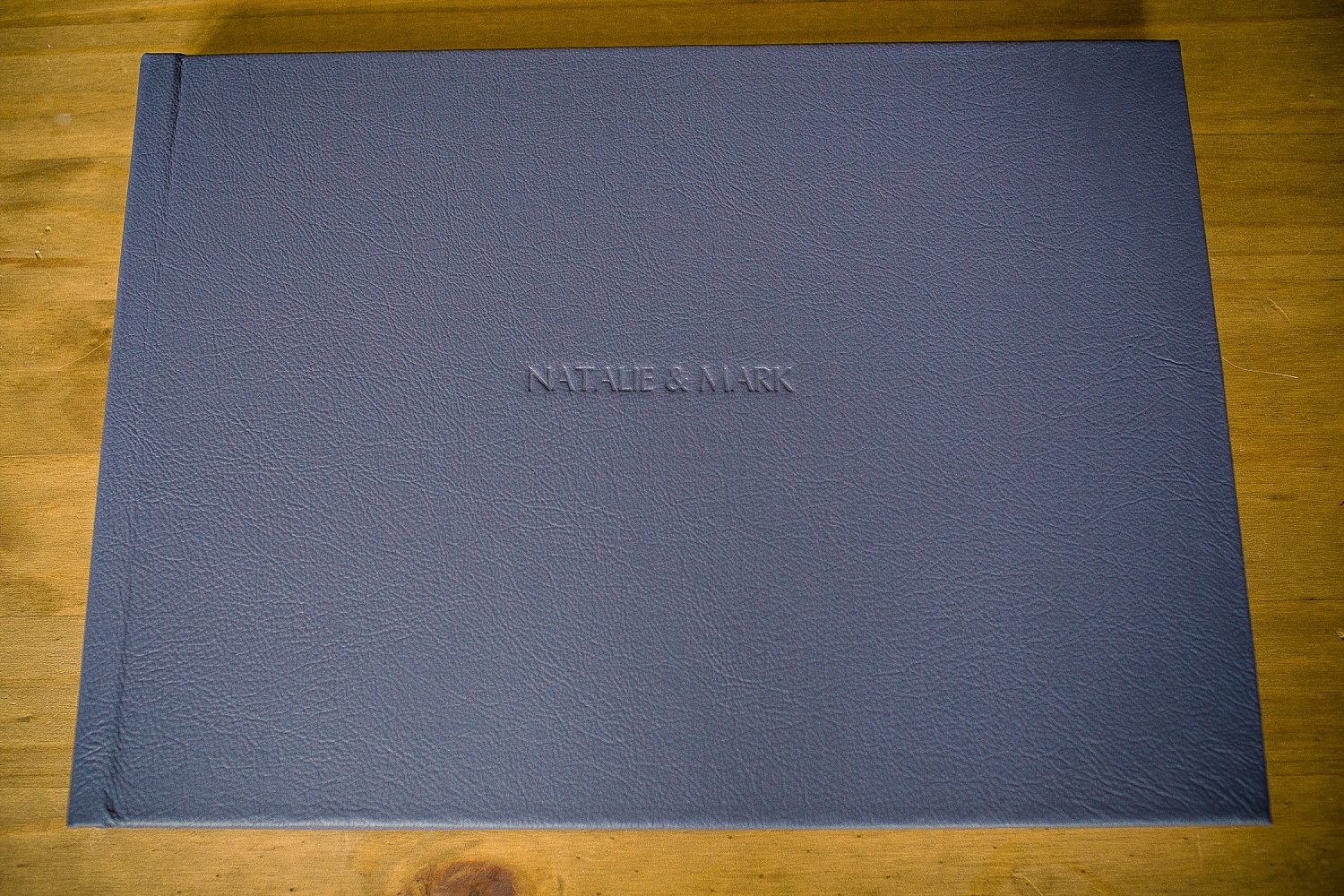 Blue leather album cover with blind embossing