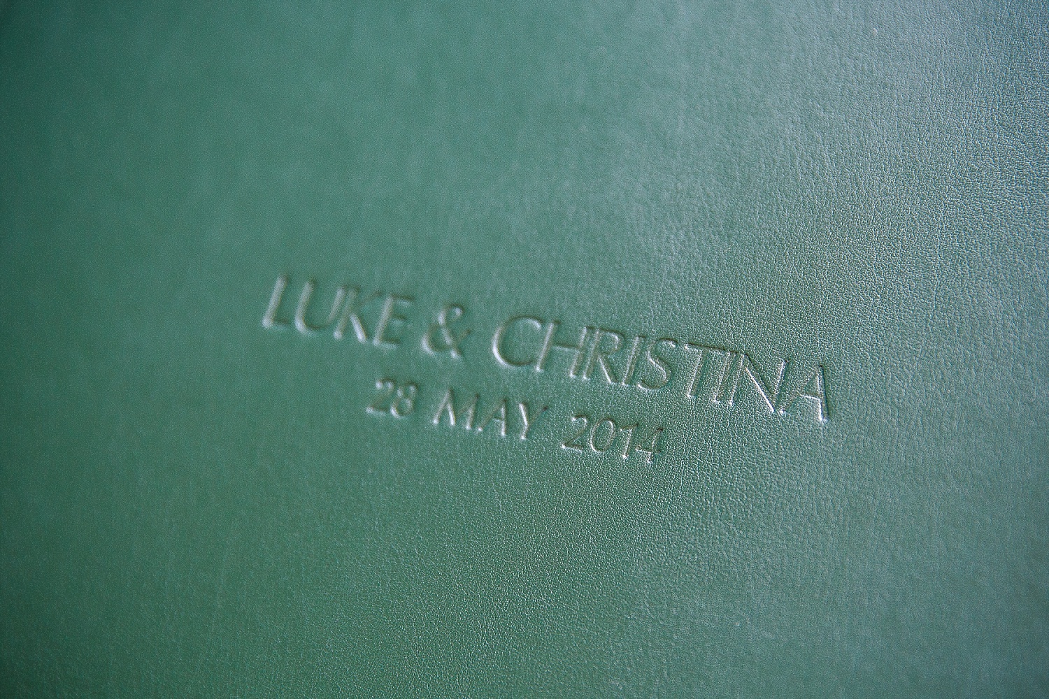 Bottle green leather album cover with blind embossing