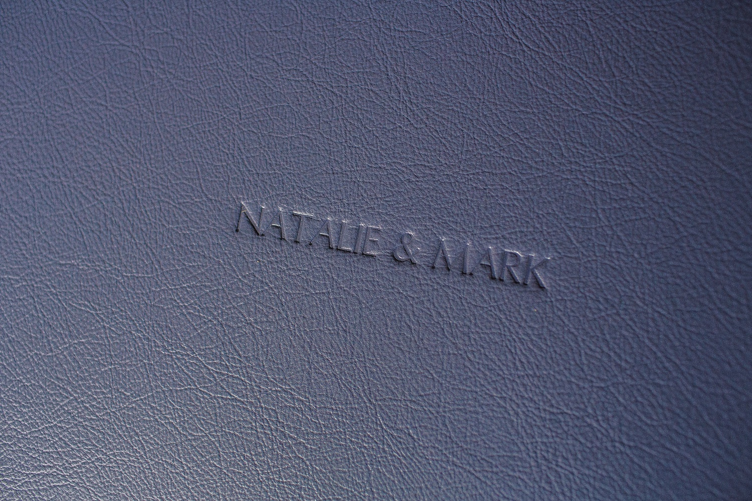 Blue leather album cover with blind embossing