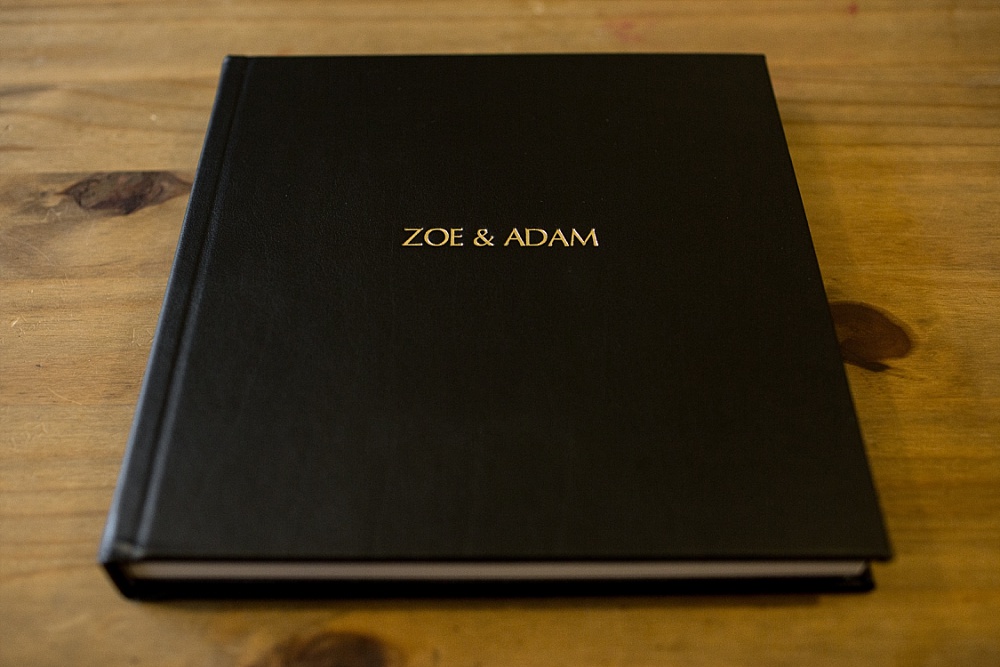 Black leather album cover with gold embossing