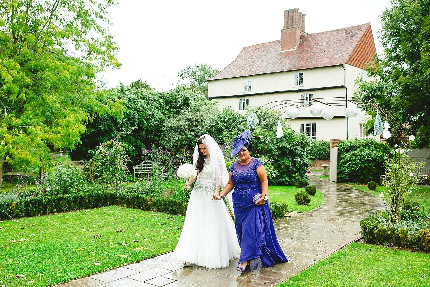 Houchins Wedding Photographer - Bride and Mother of the Bride Walking to the Ceremony