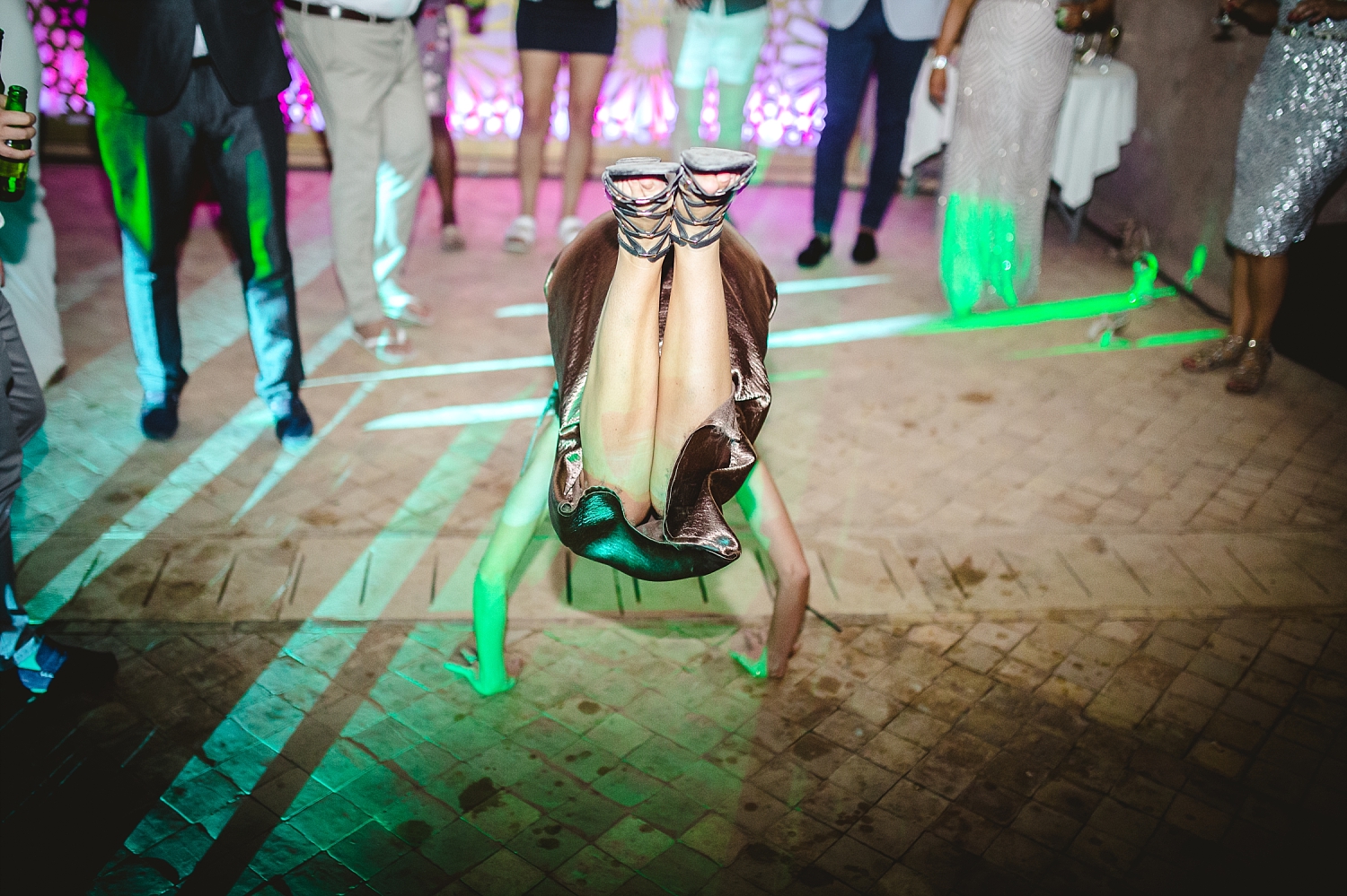 Morocco Wedding Photographer Guest doing the caterpillar on the dancefloor