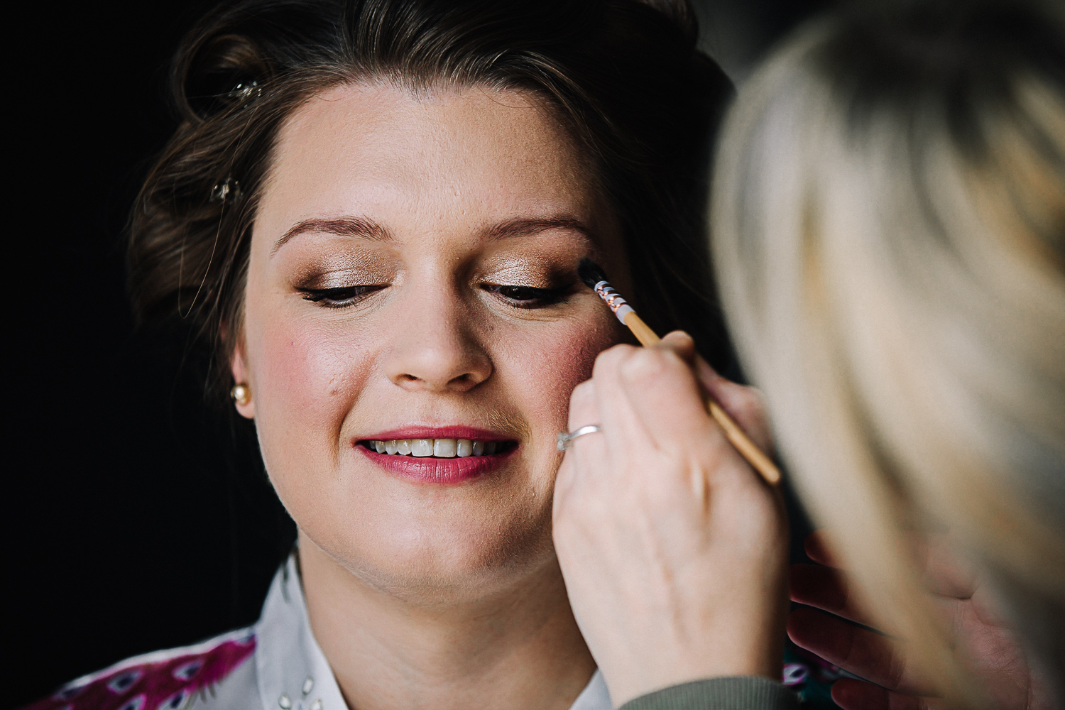 Bride getting her makeup applied - Swynford Manor Wedding Photographer
