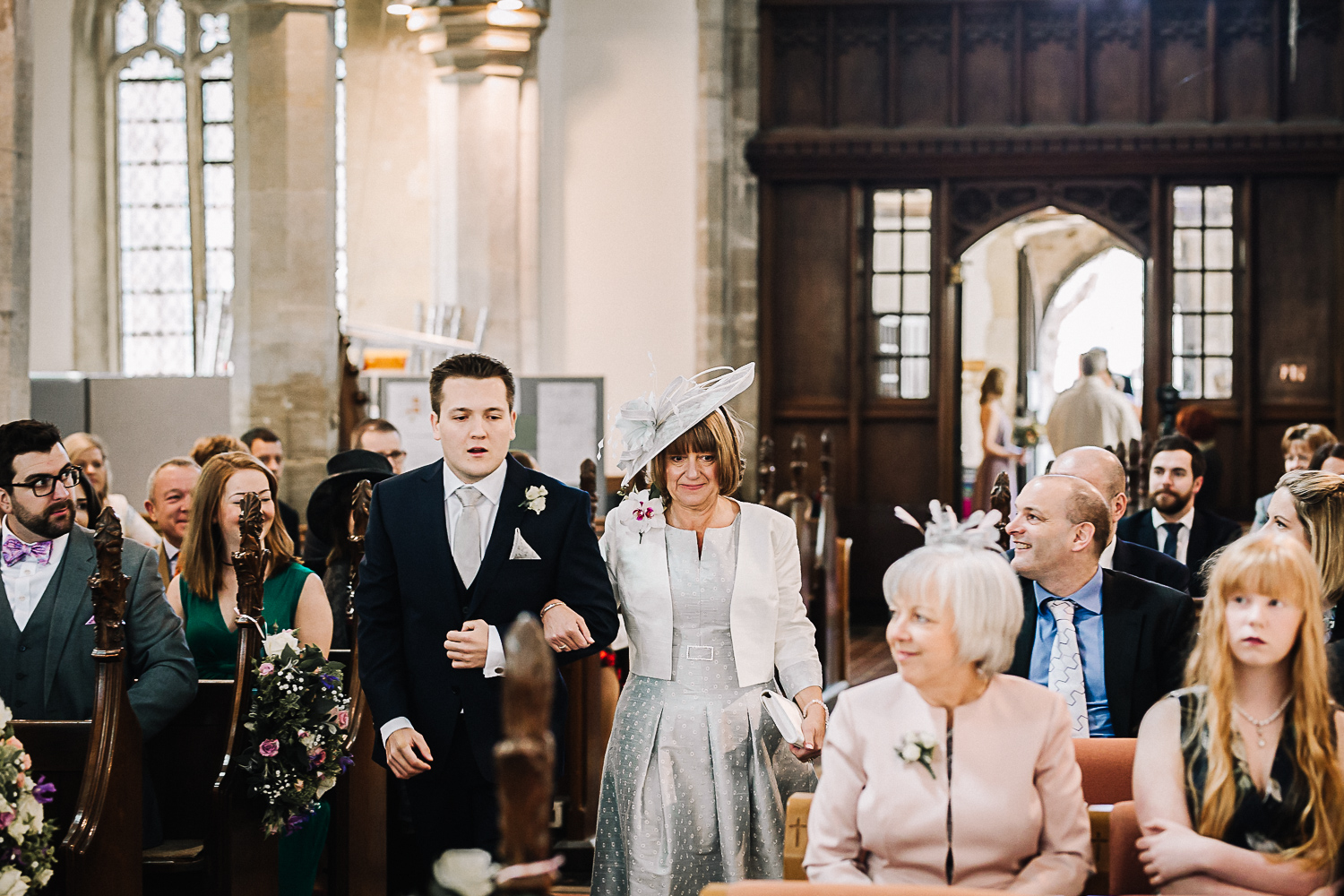 Mother of the Bride Walking Down the Aisle at Cottenham All Saint’s Church - Swynford Manor Wedding Photographer