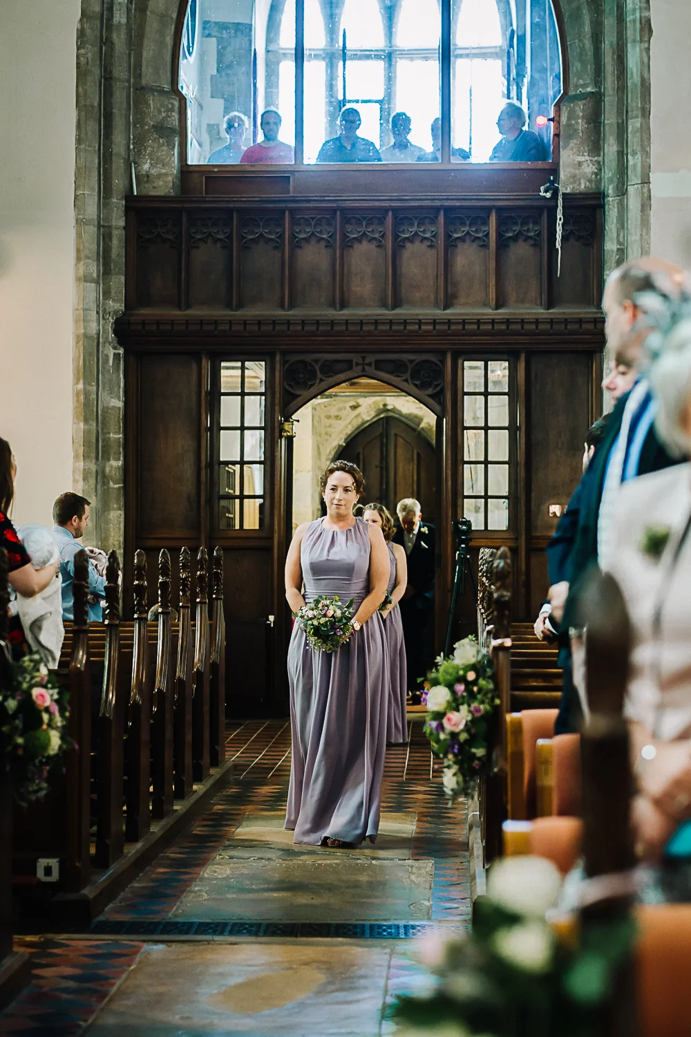 Bridesmaid Walking Down the Aisle at Cottenham All Saint’s Church - Swynford Manor Wedding Photographer