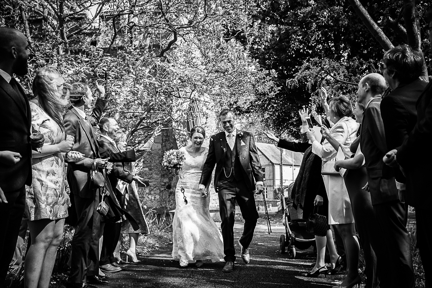 Confetti in the gardens at Cottenham All Saint’s Church - Swynford Manor Wedding Photographer