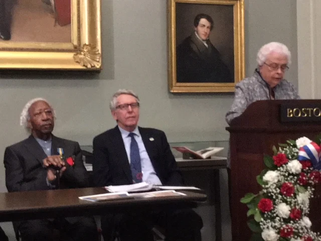 Lynette Ouellette reads the Lafayette Day Proclamation in English.