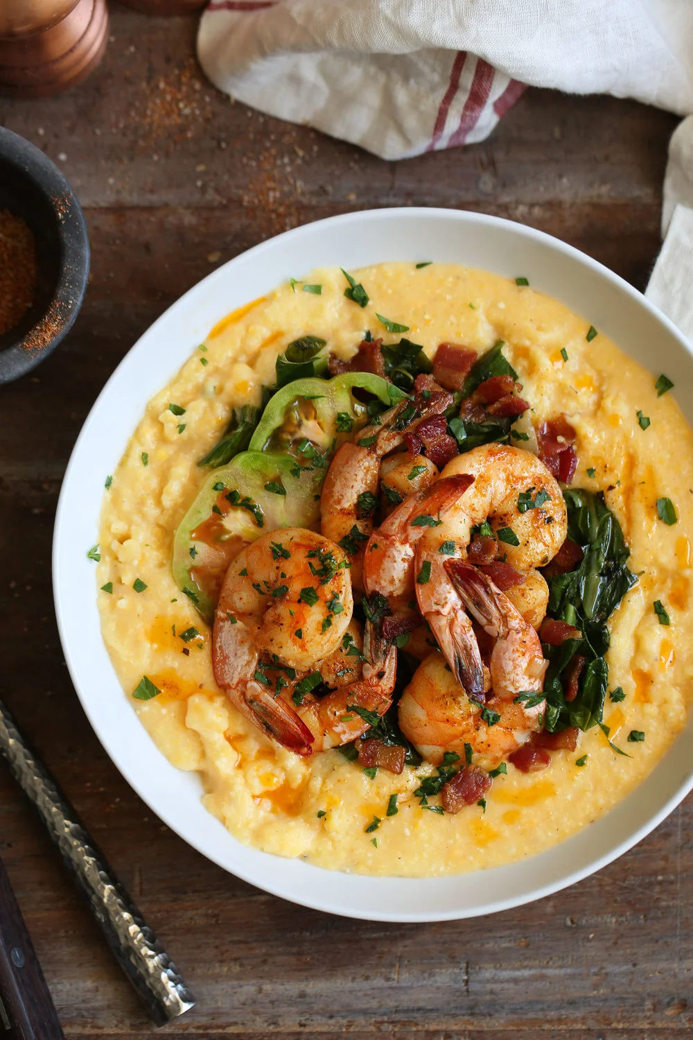 cheesy+grits+with+cajun+shrimp+and+bacon+braised+collards.jpg