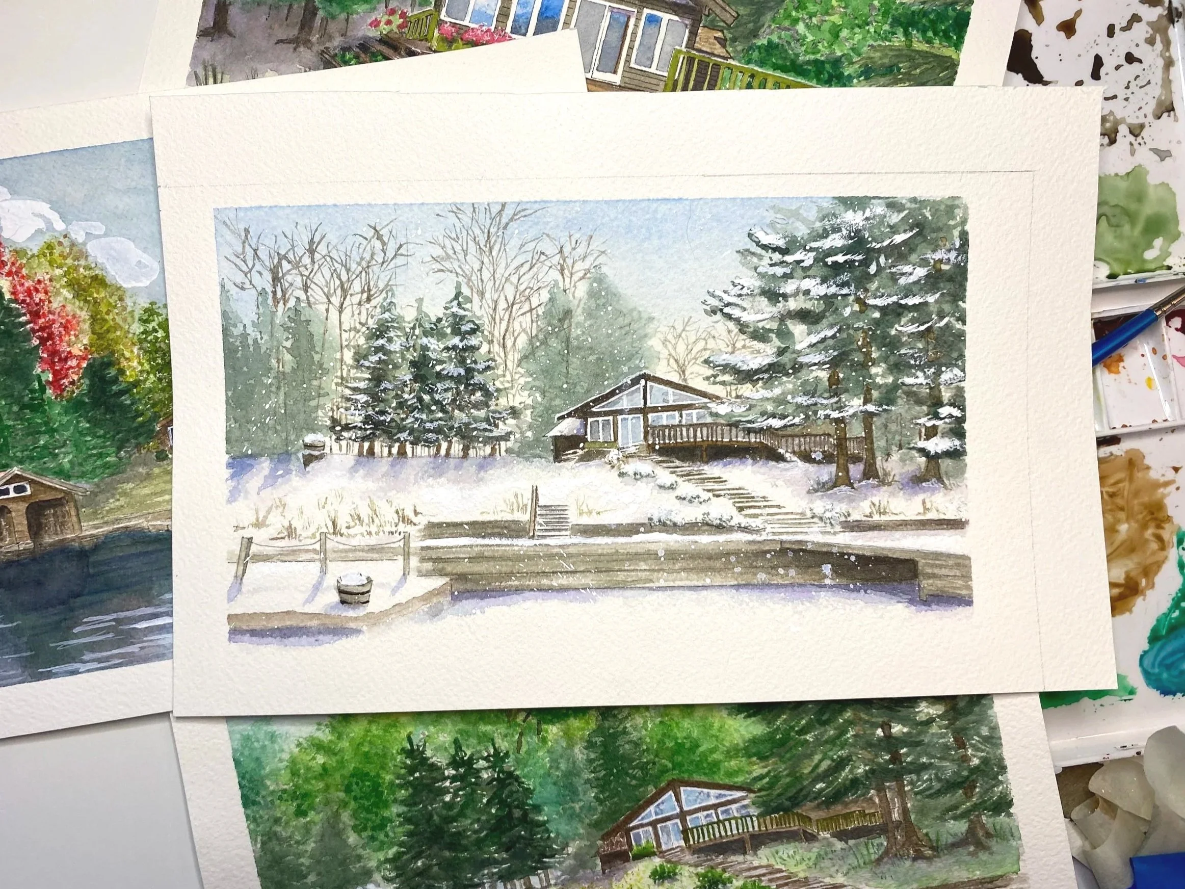 A watercolor painting of a New York lake house in a winter landscape, surrounded by snow-covered trees, with a dirt path leading to the house and a cloudy sky.