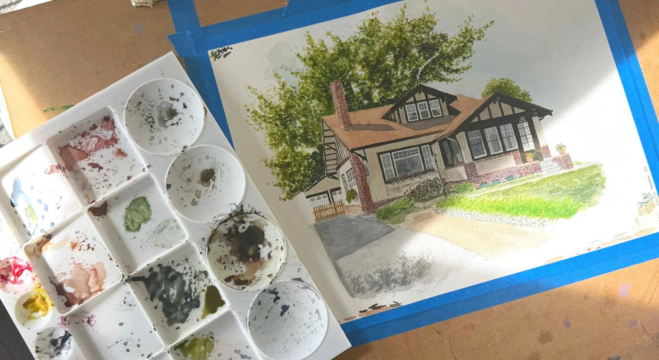 Aerial view of a home portrait painting in progress.