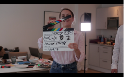 (Actress, Bridgette Wellbelove as “Jane”, slating a scene)