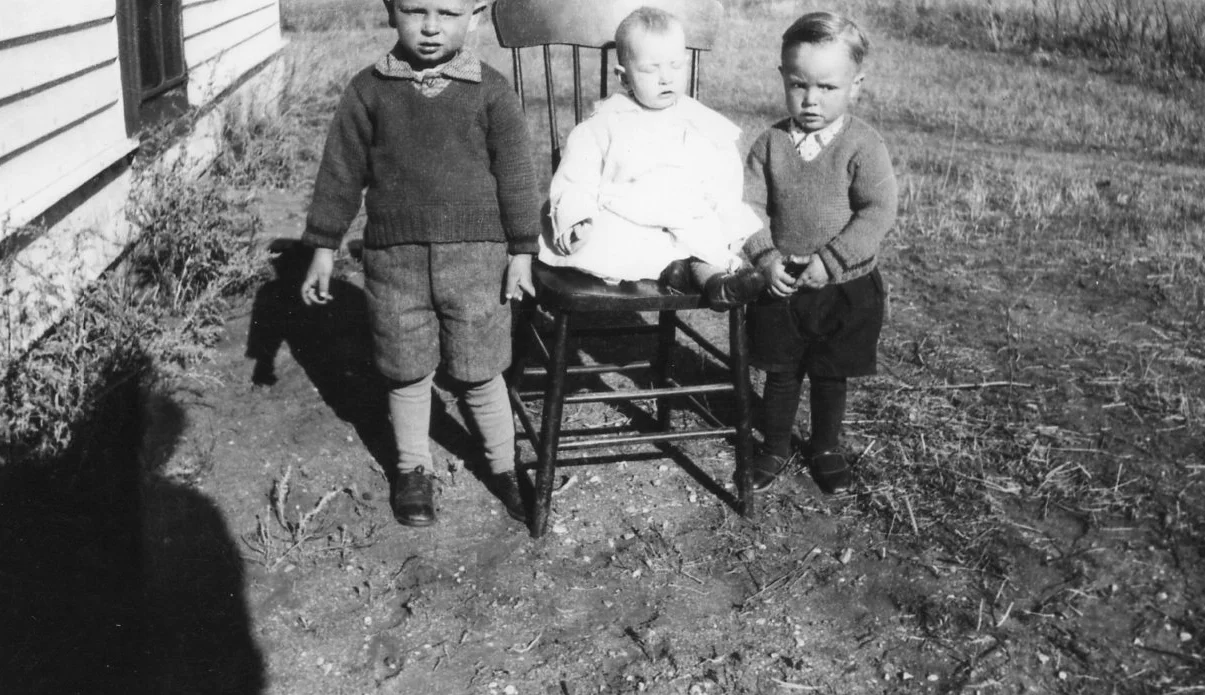 This is a photo taken by my grandfather in around 1941. My dad is the boy on the right. You can see my grandfather's shadow on the ground.
