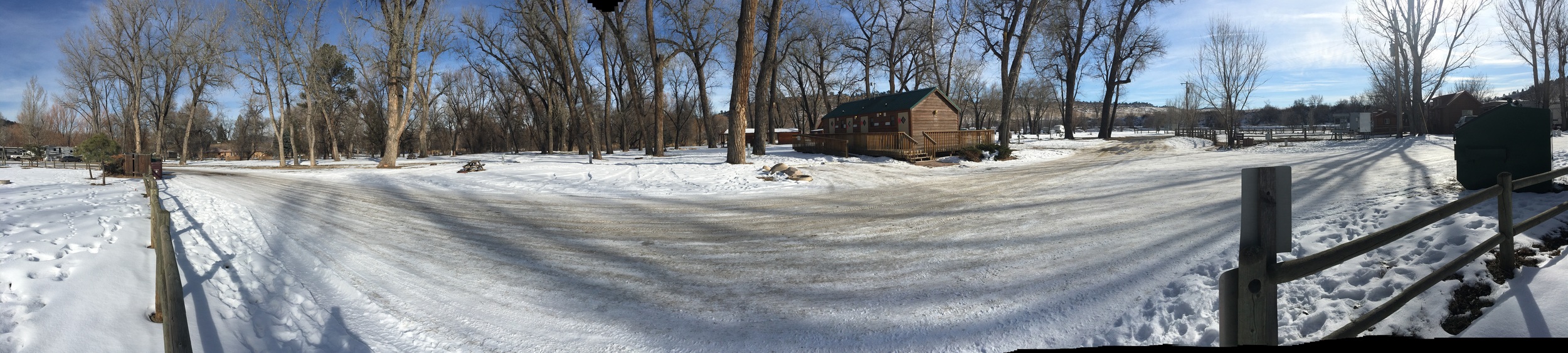 Here's a panorama of the partial hookup area as seen from the big central park. That's the bath/laundry house in the foreground, and the spaces I'm thinking of are behind and slightly left of it.