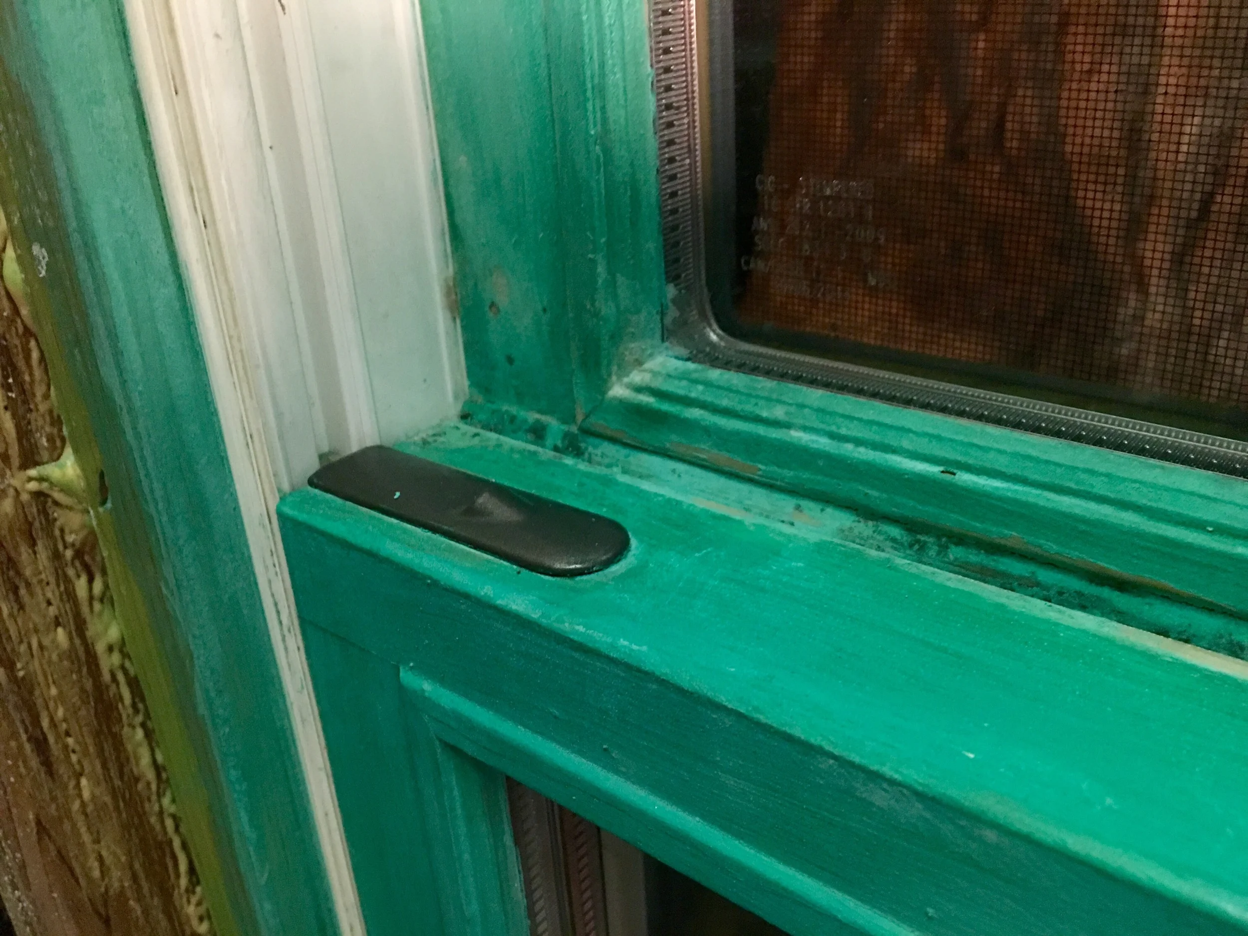 You can still see the "shadows" of mold on the milk paint window, especially in the corners like this one. Unfortunately, you can also tell the anti-mold treatments have damaged the paint job. Looks like I'll be stripping it off and starting over... Oi!