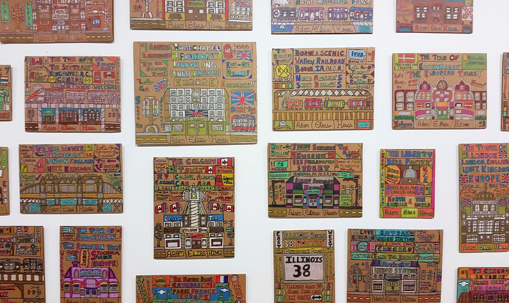An installation of drawings on cardboard by Adam Hines . Hines has an inventory of over 6,000 works.