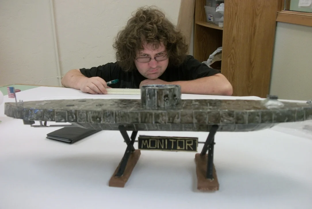 Patrick Hackelman with his model of the USS Monitor