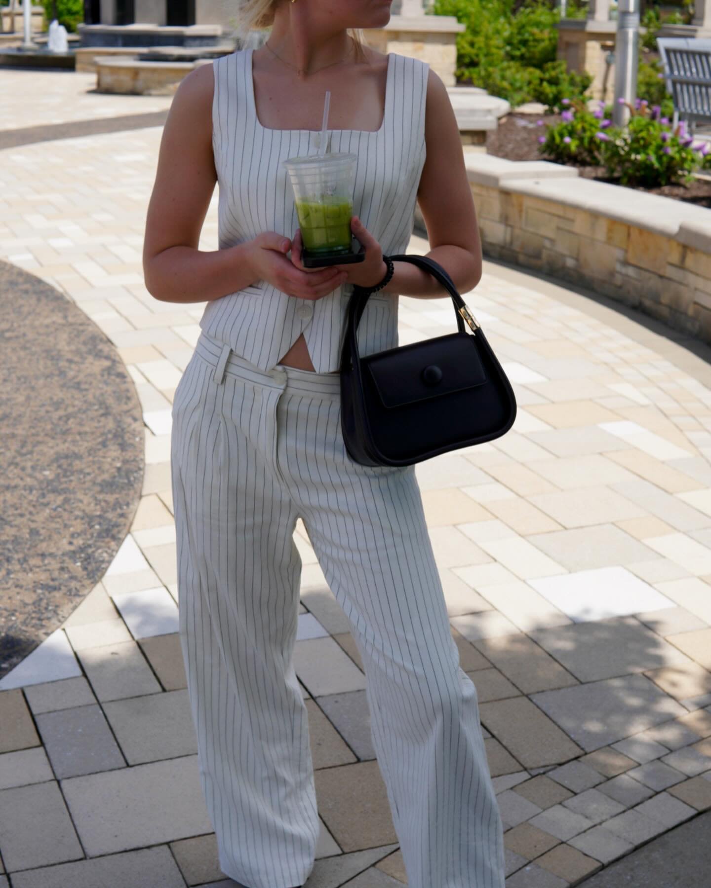 Really into black and white 🎬

Jaylan wears the Frances Vest &amp; Pants Set with the Pointy Toe Slingbacks and Jasmine Handle Bag.