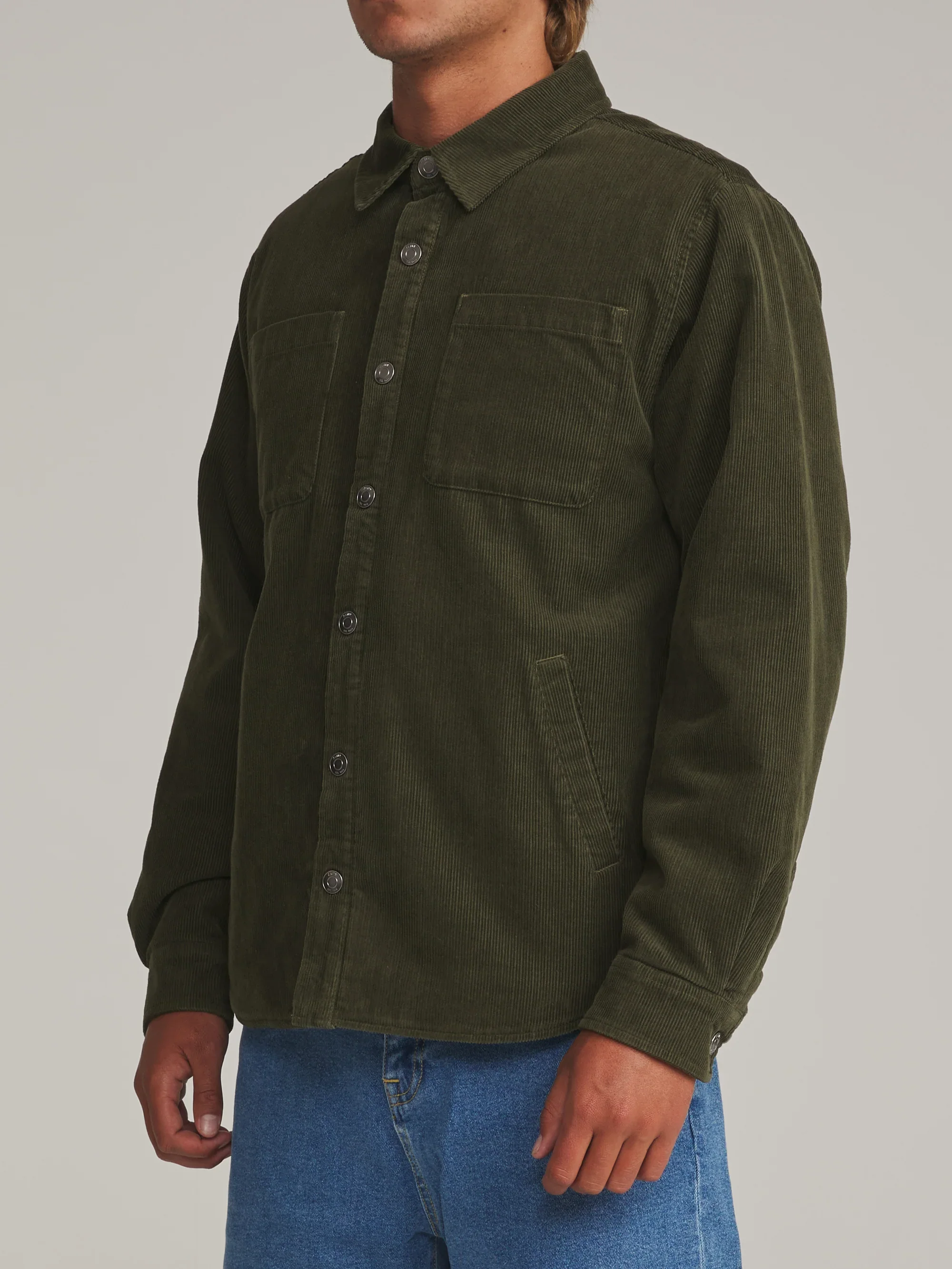 katin-fa26-shirt-jackets-harold-corduroy-shirt-jacket-dark-olive-on-model-02-side2_5000x.webp