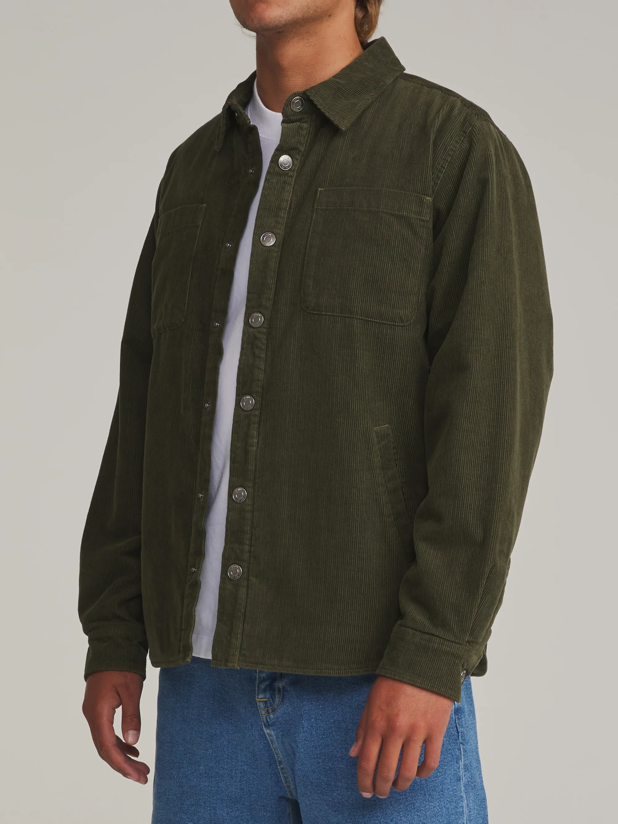 katin-fa26-shirt-jackets-harold-corduroy-shirt-jacket-dark-olive-on-model-02-side_5000x.webp