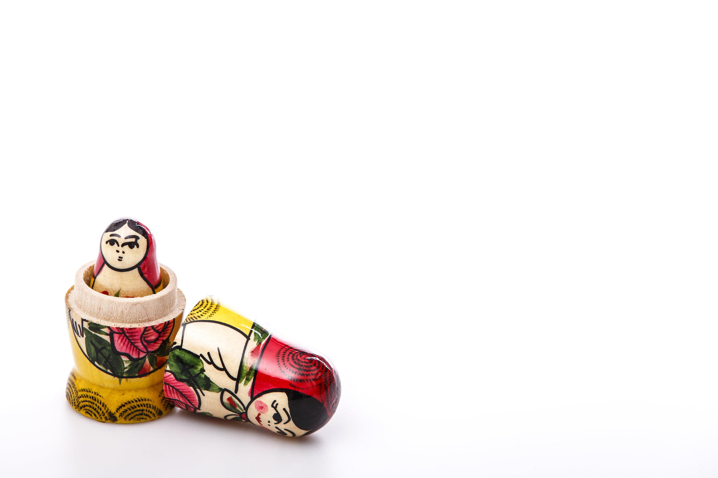 Hand-painted nesting dolls illustrating the concept of nested identity within the home, neighborhood, and town in the built environment.