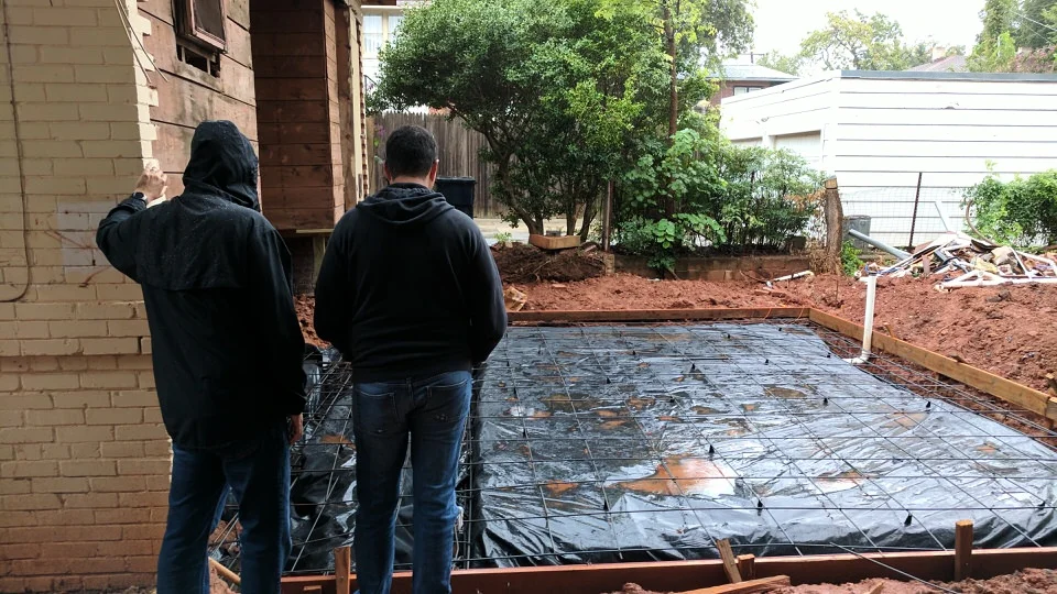 Structural Engineer and Contractor discussing reinforcing during a rain delay.